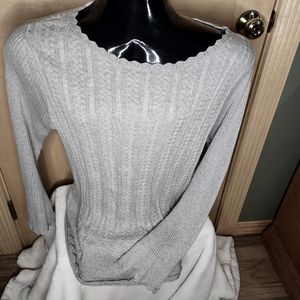Woman's sweater. Scalloped neckline, bottom of sleeve, and bottom of sweater.